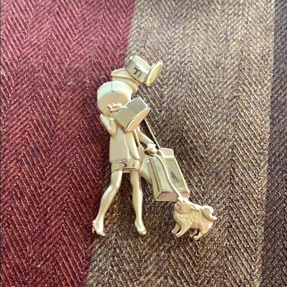 Vintage ajc woman cleaning brooch